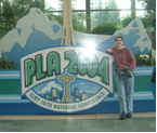 Jenine leaning on PLA 2004 sign